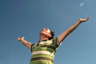 Man, arms spread, celebrating regaining his functional independence