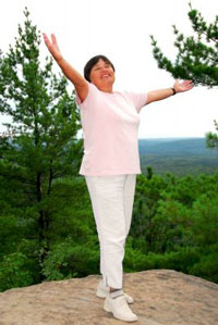 Woman celebrating her recovery after suffering a debilitating condition