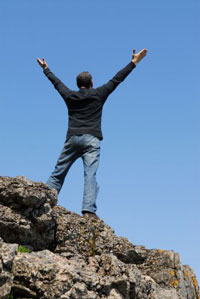 Man celebrating his recovery through occupational therapy and physical therapy